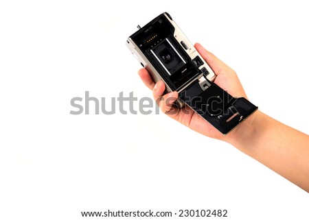 film camera in hand isolated on white.