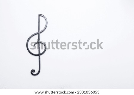 Black treble clef on a white background. Music symbol Royalty-Free Stock Photo #2301036053