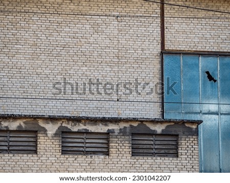 Wall and building damage to an old building Royalty-Free Stock Photo #2301042207