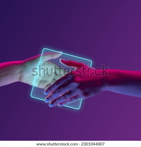 Portrait with human hands shaking hands near glowing square over minimal purple background in neon light. Concept of geometric figures, partnership, virtual reality, cooperation, technologies, ad Royalty-Free Stock Photo #2301044007