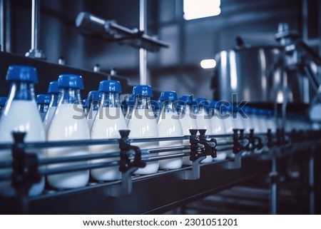 Milk factory. Robotic factory line for processing and bottling of milk. Selective focus.