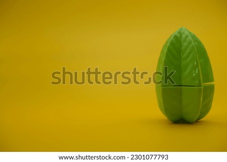 toy star fruit isolated yellow background. starfruit toys that can be installed and removed.