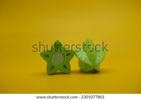 toy star fruit isolated yellow background. starfruit toys that can be installed and removed.