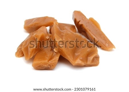 Caramel candies isolated on white background Royalty-Free Stock Photo #2301079161
