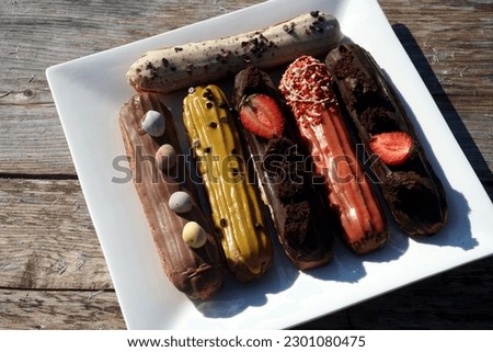    Sweet food eclairs of different types. Sweet shacks                            