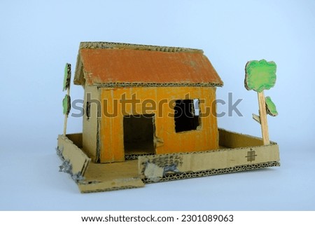 Cardboard toy house for kids on a white background