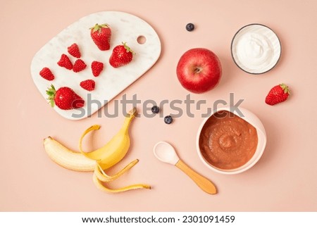Baby puree recipe made of fresh fruits. First baby solid food recipe idea. Top view,  flat lay Royalty-Free Stock Photo #2301091459
