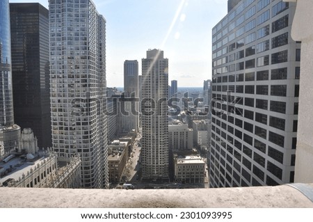 Looking over a ledge at the Chicago skyline in summer day Royalty-Free Stock Photo #2301093995