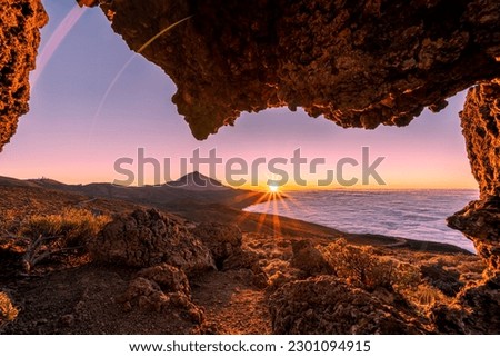 Sunset at Mirador de la Tarta, with view on the Teide volcano and low clouds, on Tenerife, Spain  Royalty-Free Stock Photo #2301094915