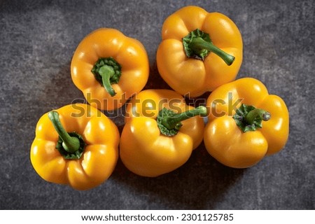 Yellow paprika on a gray background