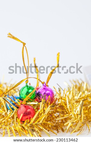 Christmas composition with gift box and decorations on white paper background.