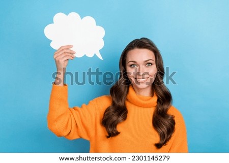 Photo of positive lady holding paper poster telling saying idea dialog message isolated on blue color background