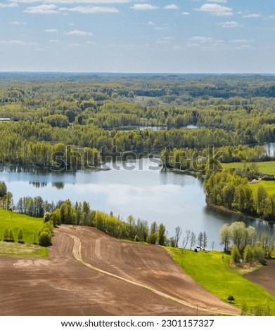 Spring landscape by lake  Ārdava Latvia, in the countryside of Latgale.
