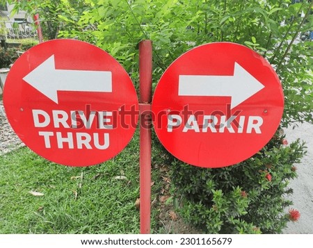 The words Drive thru are white on a red background