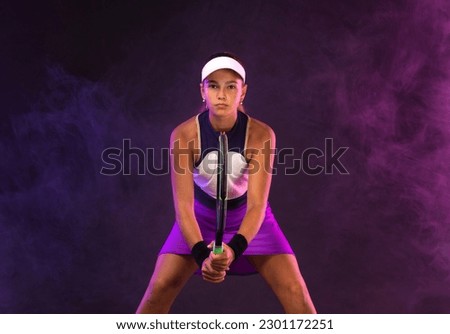 Tennis player in neon colors. Beautiful girl teenager athlete on tennis court. Fitness and sport concept. Download high resolution photo to advertise children's tennis academy