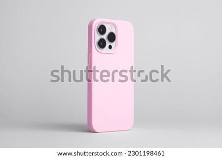 iPhone 13 Pro and 14 in pink case back side view isolated on grey background, phone case mock up