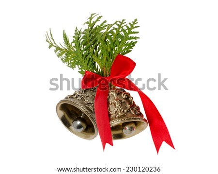 Christmas bells decorated with fir branches and red ribbon