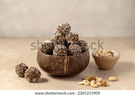 Energy balls. No cook energy protein, bites made from coconut flakes, oats, dried fruits and nuts. Royalty-Free Stock Photo #2301215909