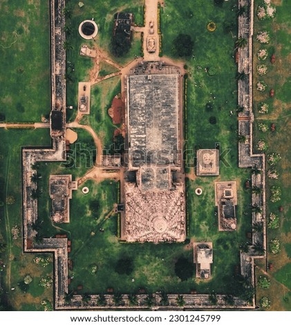 drone shot aerial view top angle bright sunny photo of hindu architecture tanjore Gangaikondacholapuram palace huge temple lawn green grass historical site unesco heritage india tamilnadu tourism 