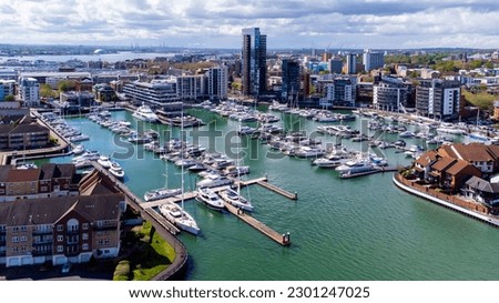 Ocean Village Marina is a redevelopped neighborhood of Southampton on the Channel coast in southern England, UK. It has a residential tower and a luxury hotel that mimics the shape of a cruise ship. Royalty-Free Stock Photo #2301247025