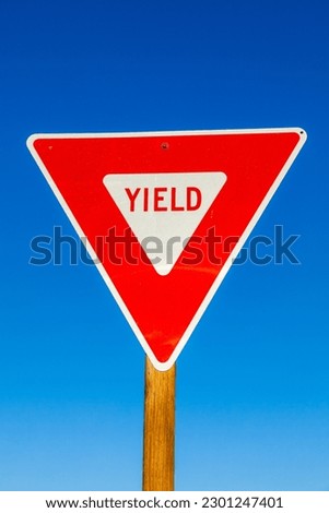 yield Sign at the highway with clear blue sky