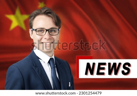News anchor, tells the latest news, smiling, against the background of the flag of China. Media and propaganda.