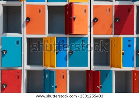 Array of safety lockers for luggage on a beach Royalty-Free Stock Photo #2301255403