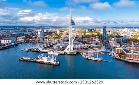 Aerial view of the sail-shaped Spinnaker Tower in Portsmouth Harbor in the south of England on the Channel coast - Gunwharf Quays modern shopping mall in a residential waterfront area Royalty-Free Stock Photo #2301262529