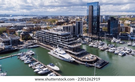 Ocean Village Marina is a redevelopped neighborhood of Southampton on the Channel coast in southern England, UK. It has a residential tower and a luxury hotel that mimics the shape of a cruise ship. Royalty-Free Stock Photo #2301262919