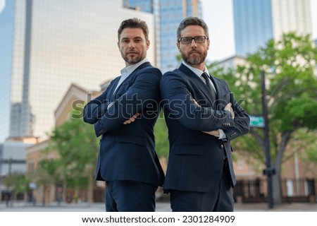 Business success men outdoor. Two businessmen on business successful meeting in city. Successful partnership. Men on city street outdoor. Business strategy. Business teams success. Royalty-Free Stock Photo #2301284909