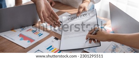 Panorama shot hand signing signature on legal contract, business report and BI Fintech paper on table. Seal business agreement deal with signature. Investment loan for startup company. Scrutinize