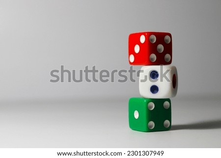 Close up of three different colored dice isolated on white background