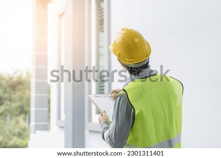 Builder inspection consultancy. Inspector checking material and structure in construction. Royalty-Free Stock Photo #2301311401