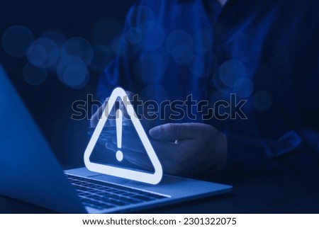 Businessman or employee with warning triangle sign for warning error Hack Alert System Warning cyber attack