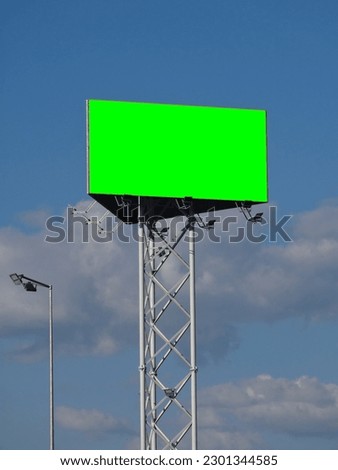 A billboard with a green area