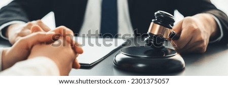 Lawyer colleagues or legal team working or drafting legal document at law firm office desk. Gavel hammer for righteous and equality judgment by lawmaker and attorney. Equilibrium