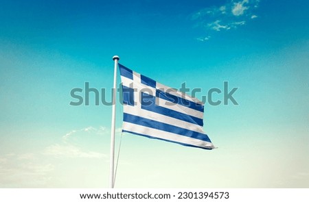 Waving flag of Greece in beautiful sky. Greece flag for independence day.