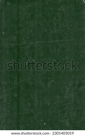 Vintage background of old green book paper texture with scratches