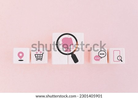 pink lady inside magnifying glass icon on wooden cube blocks with others business icon for buyer persona and target customer concept, buyer or customer psychology profile or characteristics  Royalty-Free Stock Photo #2301405901