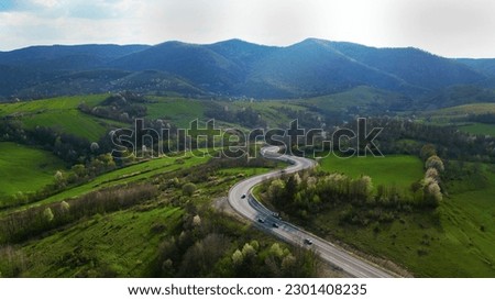 Top view of a rural road, Apuseni mountains, Romania. Royalty-Free Stock Photo #2301408235