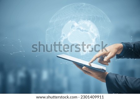 Close up of male hand holding and pointing at cellphone with glowing polygonal globe on blurry city background. World map and earth concept