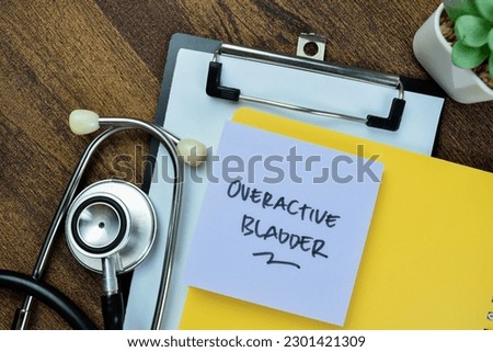 Concept of Overactive Bladder write on sticky notes with stethoscope isolated on Wooden Table.
