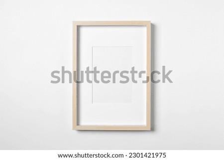 Empty wooden frame on white background. Mockup for design