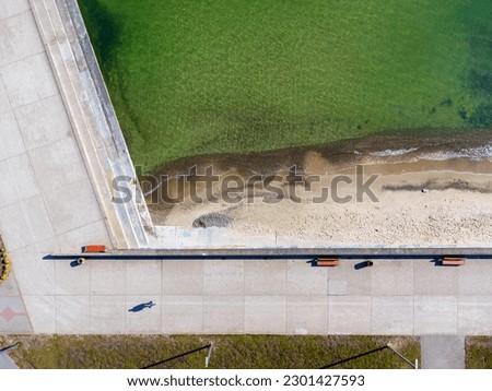 Aerial view landscape Poland Gdynia, city boulevard , drone photo, Baltic sea, concrete promenade, rocky coast.