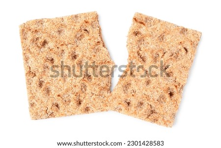 Fresh broken crispbread on white background, top view Royalty-Free Stock Photo #2301428583