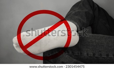 Sign prohibited on white socks. Dirty, white socks on the feet.