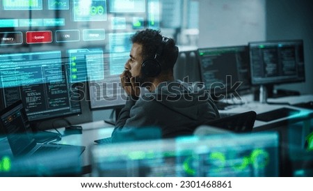 Software Developer Working on Computer, Engineering Neural Networking, Machine Learning, Big Data, Artificial Intelligence. Edited Coding Language Projection Overlayes the Screen. Back View Shot