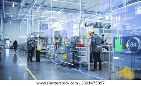 Factory Digitalization: Two Industrial Engineers Use Laptop Computer, Big Data Statistics Visualization, Optimization of High-Tech Electronics Facility. Industry 4.0 Machinery Manufacturing Products Royalty-Free Stock Photo #2301475857