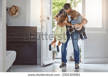 Hug, welcome and a father with children at front door, greeting after work and excited to be home. Happy, family and a dad hugging a girl and boy kid after arriving from a job with love in a house Royalty-Free Stock Photo #2301505081