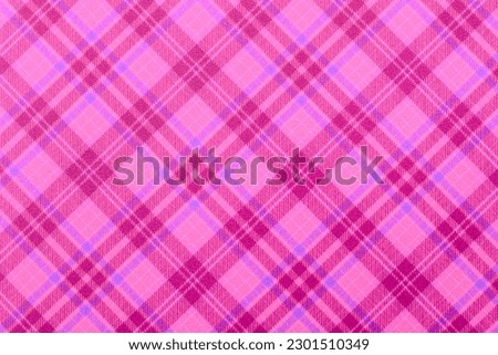 Christmas violet purple checkered background, texture seamless pink pattern fabric checkered, gingham backdrop. Plain classic Scottish plaid design. Suitable flannel pink textile. top view of table. Royalty-Free Stock Photo #2301510349
